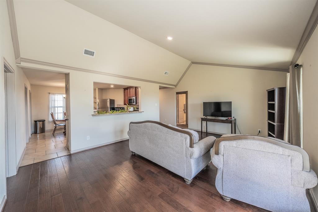 2376 Farm To Market Road 2264 Decatur, TX 76234 - Photo 21 of 39 a living room with furniture and a flat screen tv