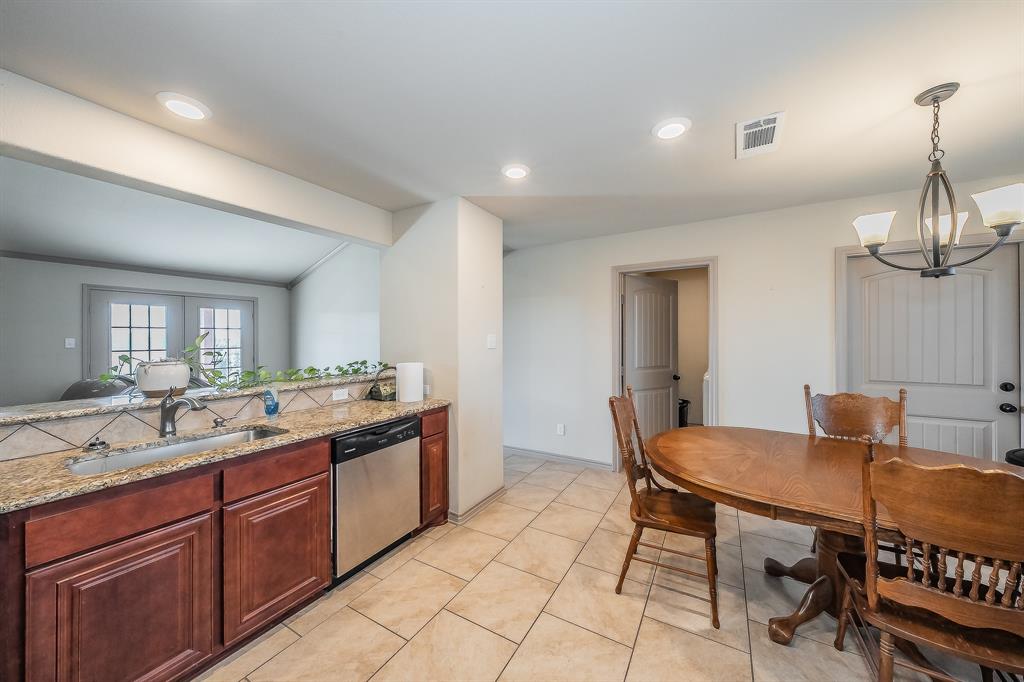 2376 Farm To Market Road 2264 Decatur, TX 76234 - Photo 24 of 39 a kitchen with a sink and chairs