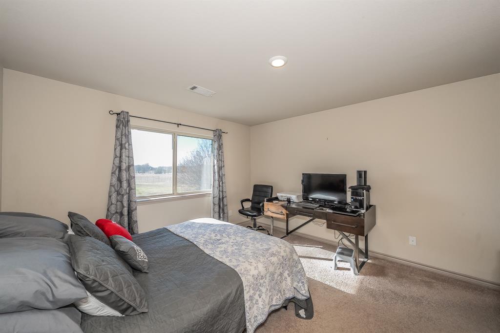 2376 Farm To Market Road 2264 Decatur, TX 76234 - Photo 28 of 39 a bedroom with a bed and a window