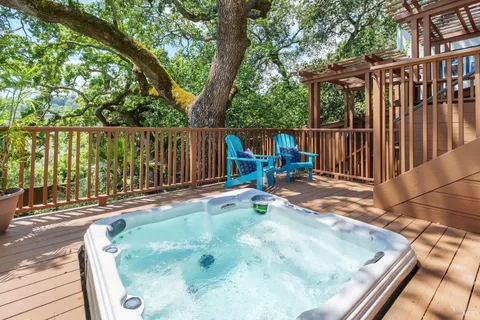 a view of a roof deck with wooden floor and fence