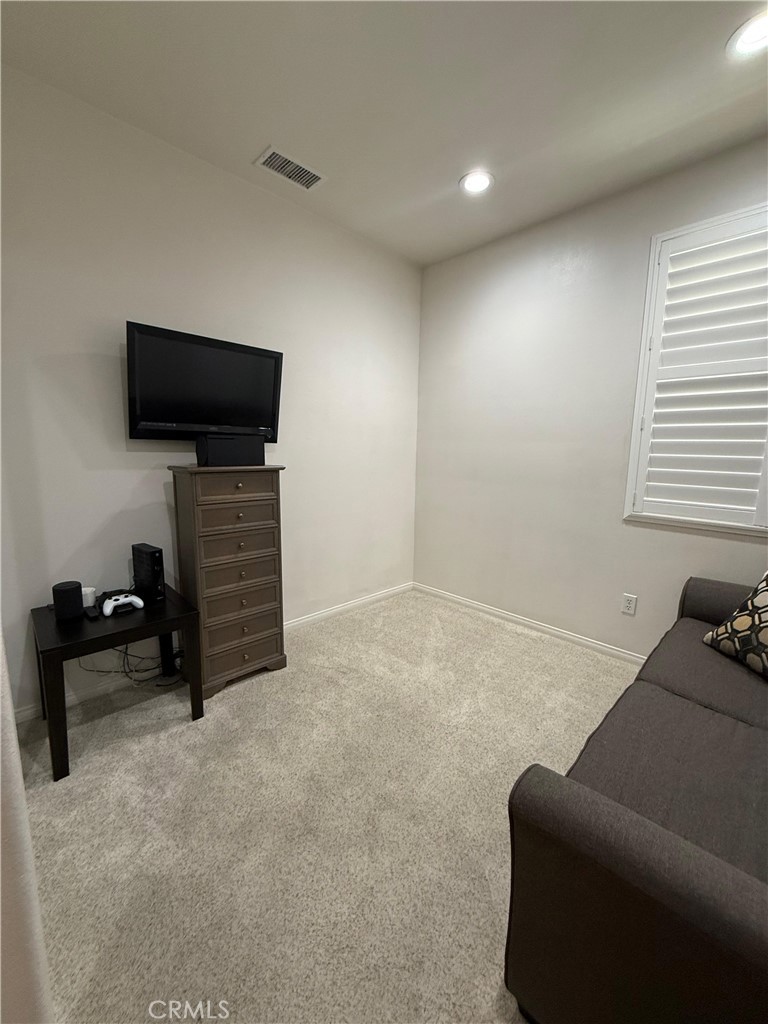 2931 Esperanza Way, Unit B Simi Valley, CA 93063 - Photo 46 of 49 a living room with furniture and a flat screen tv