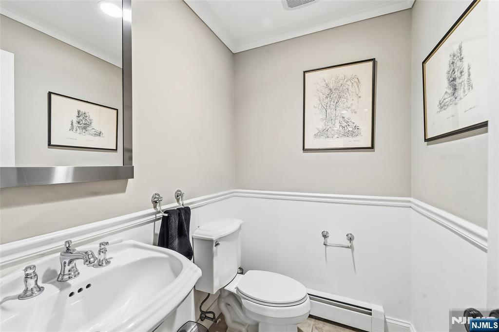 27 Pine Hill Road Old Tappan, NJ 07675 - Photo 18 of 50 a white toilet sitting next to a bathroom sink