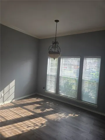 a view of an empty room with windows