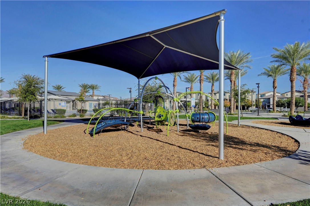 6924 Spicy Merlot Street North Las Vegas, NV 89086 - Photo 71 of 83 A well-maintained community playground offers shaded recreation and engaging play structures.