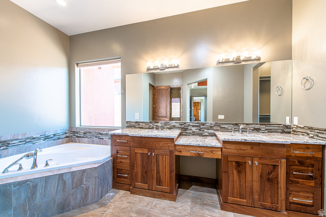 322 340 E Street Ivins, UT 84738 - Photo 28 of 61 Dual wood-finish vanities with undermount sinks and light-toned countertops, featuring an integrated makeup vanity