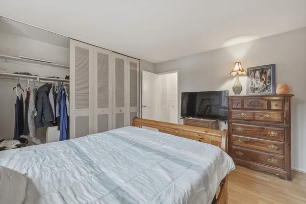 a bedroom with a bed and a television in it