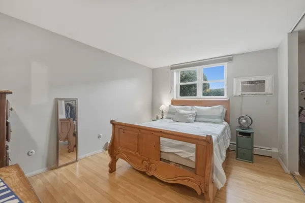 a bedroom with a bed and a table in it