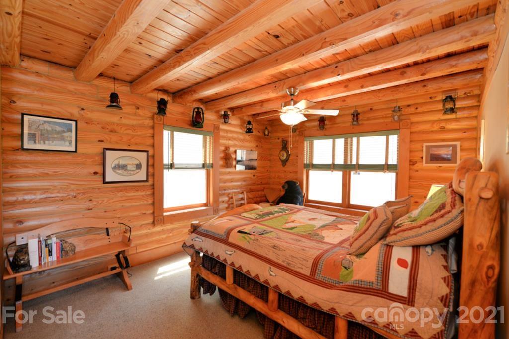 175 Owl Lookout Sylva, NC 28779 - Photo 12 of 20 a bedroom with a bed next to a window