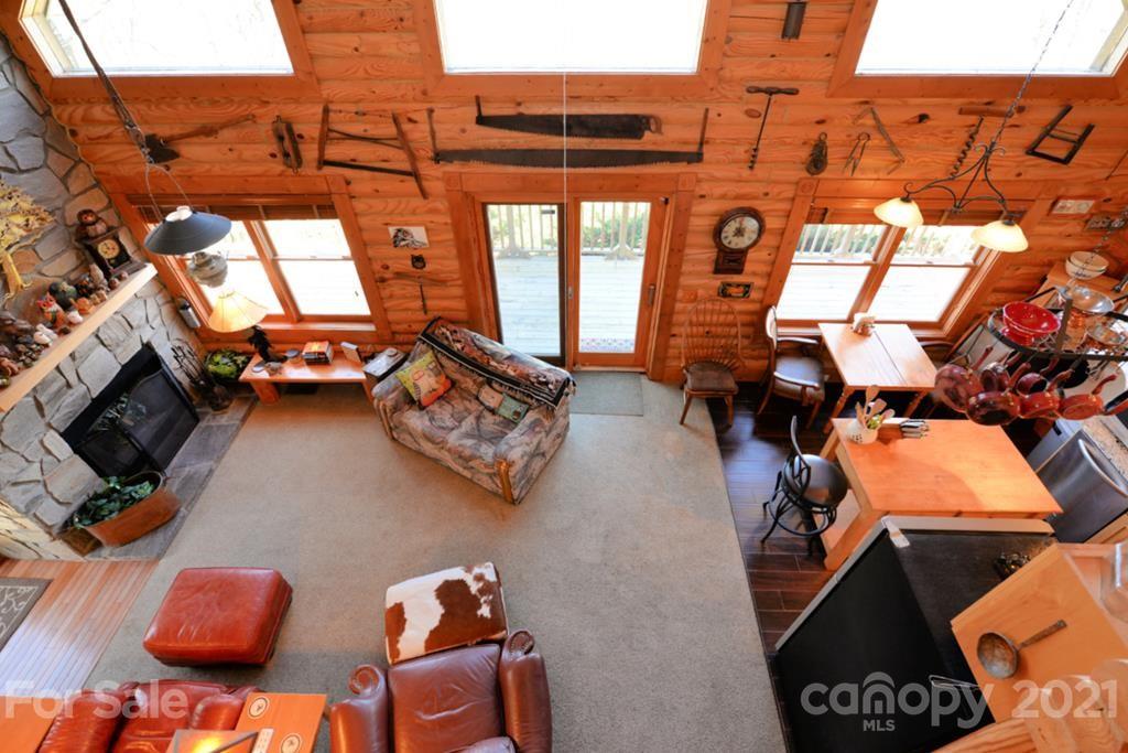 175 Owl Lookout Sylva, NC 28779 - Photo 15 of 20 an outdoor living area with furniture and a fireplace