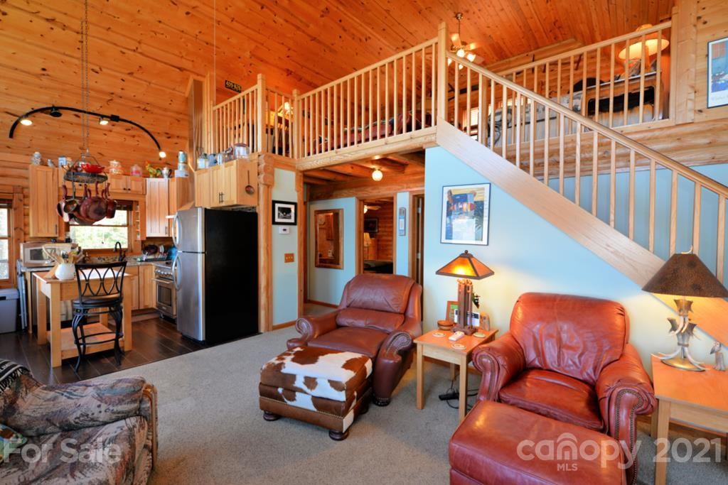 175 Owl Lookout Sylva, NC 28779 - Photo 8 of 20 a backyard of a house with barbeque oven table and chairs