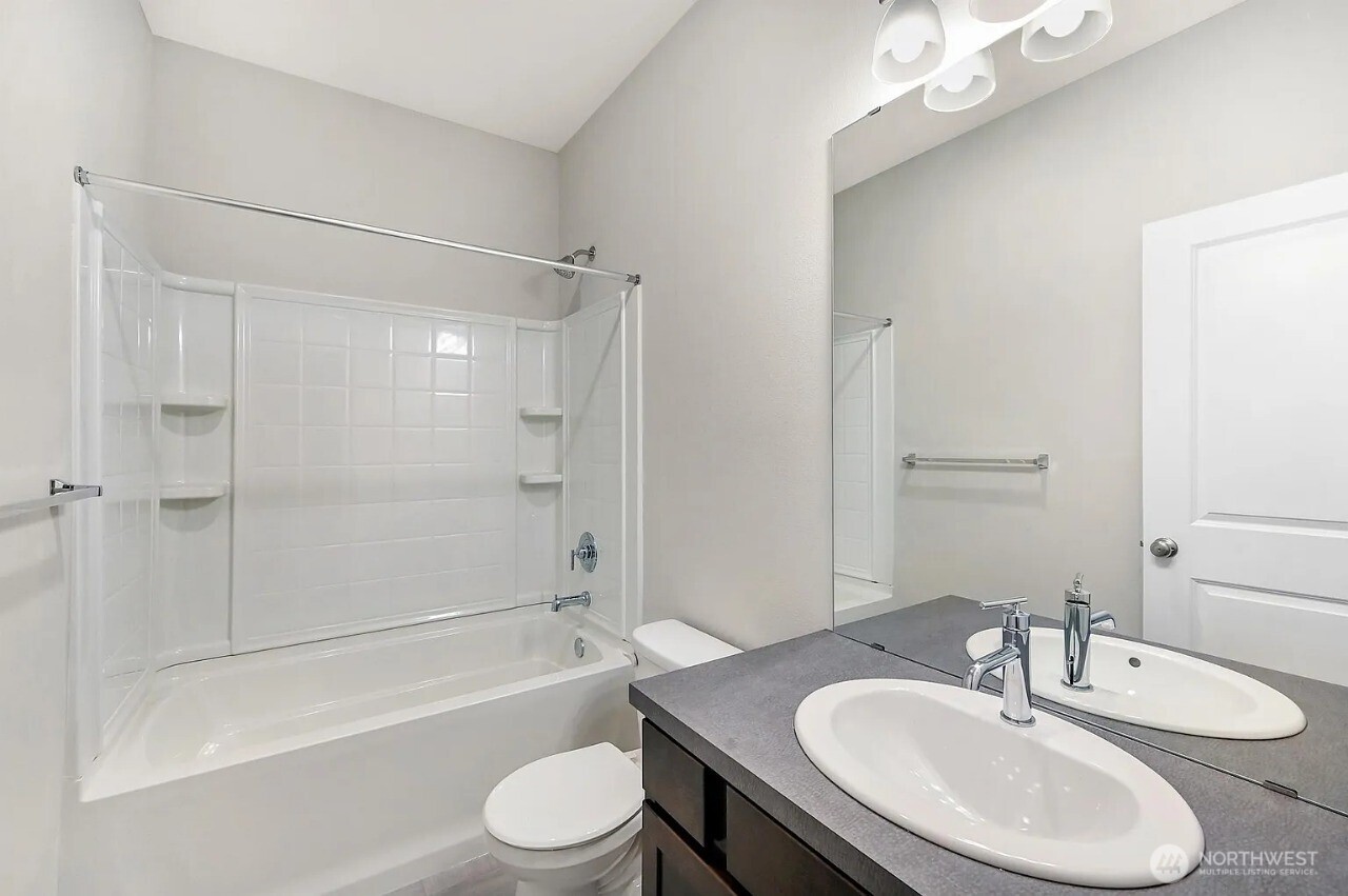 13117 3rd Avenue Southeast, Unit D5 Everett, WA 98208 - Photo 13 of 22 a bathroom with a sink toilet and shower