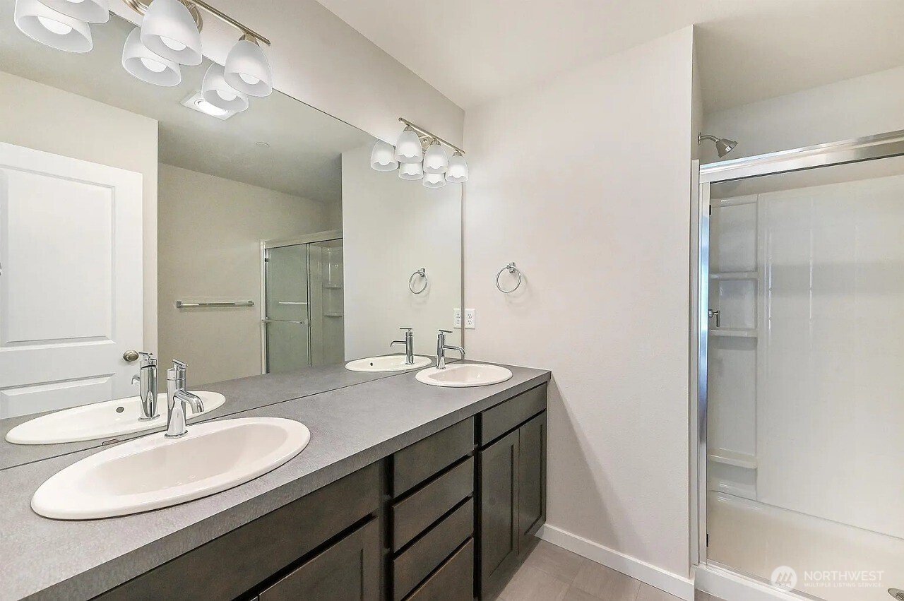 13117 3rd Avenue Southeast, Unit D5 Everett, WA 98208 - Photo 15 of 22 a bathroom with a double vanity sink and a mirror