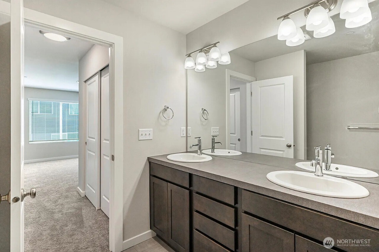 13117 3rd Avenue Southeast, Unit D5 Everett, WA 98208 - Photo 16 of 22 a bathroom with a sink double vanity and a mirror