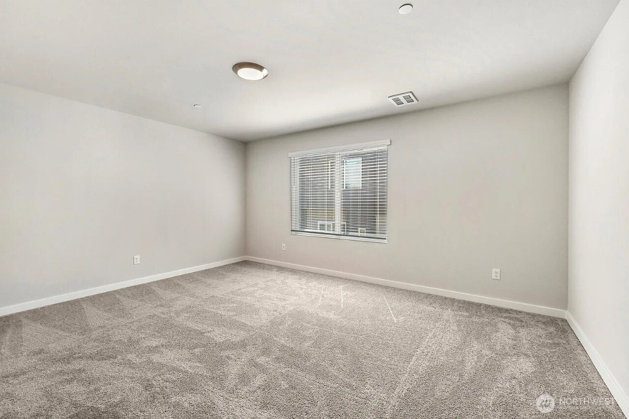 13117 3rd Avenue Southeast, Unit D5 Everett, WA 98208 - Photo 18 of 22 an empty room with windows