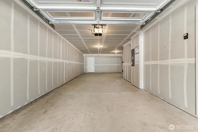 a view of entryway and hall with a front door