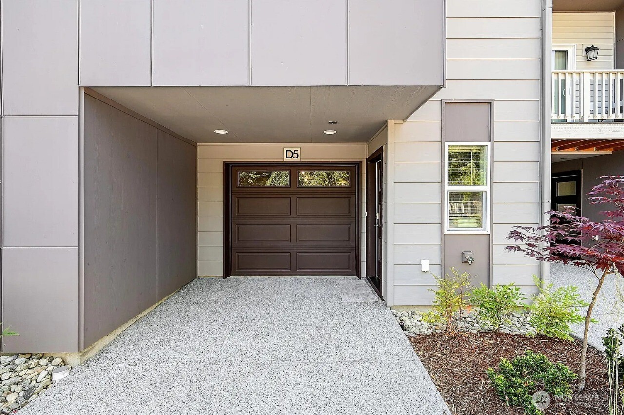 13117 3rd Avenue Southeast, Unit D5 Everett, WA 98208 - Photo 3 of 22 a view of a porch with a bench