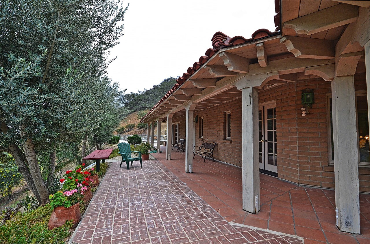 36880 Magee Road Pala, CA 92059 - Photo 24 of 25 LONG COVERED PORCH. KITCHEN, DINING, FRONT DOOR, GREAT ROOM, 2ND BEDROOM AND THE MASTER BEDROOM ALL ENJOY THE PORCH.