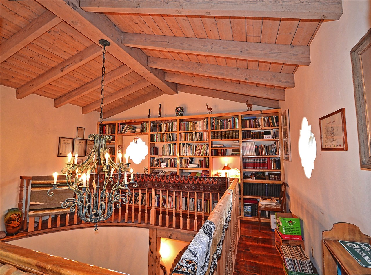 36880 Magee Road Pala, CA 92059 - Photo 8 of 25 LIBRARY BUILT AROUND THE STAIRCASE.