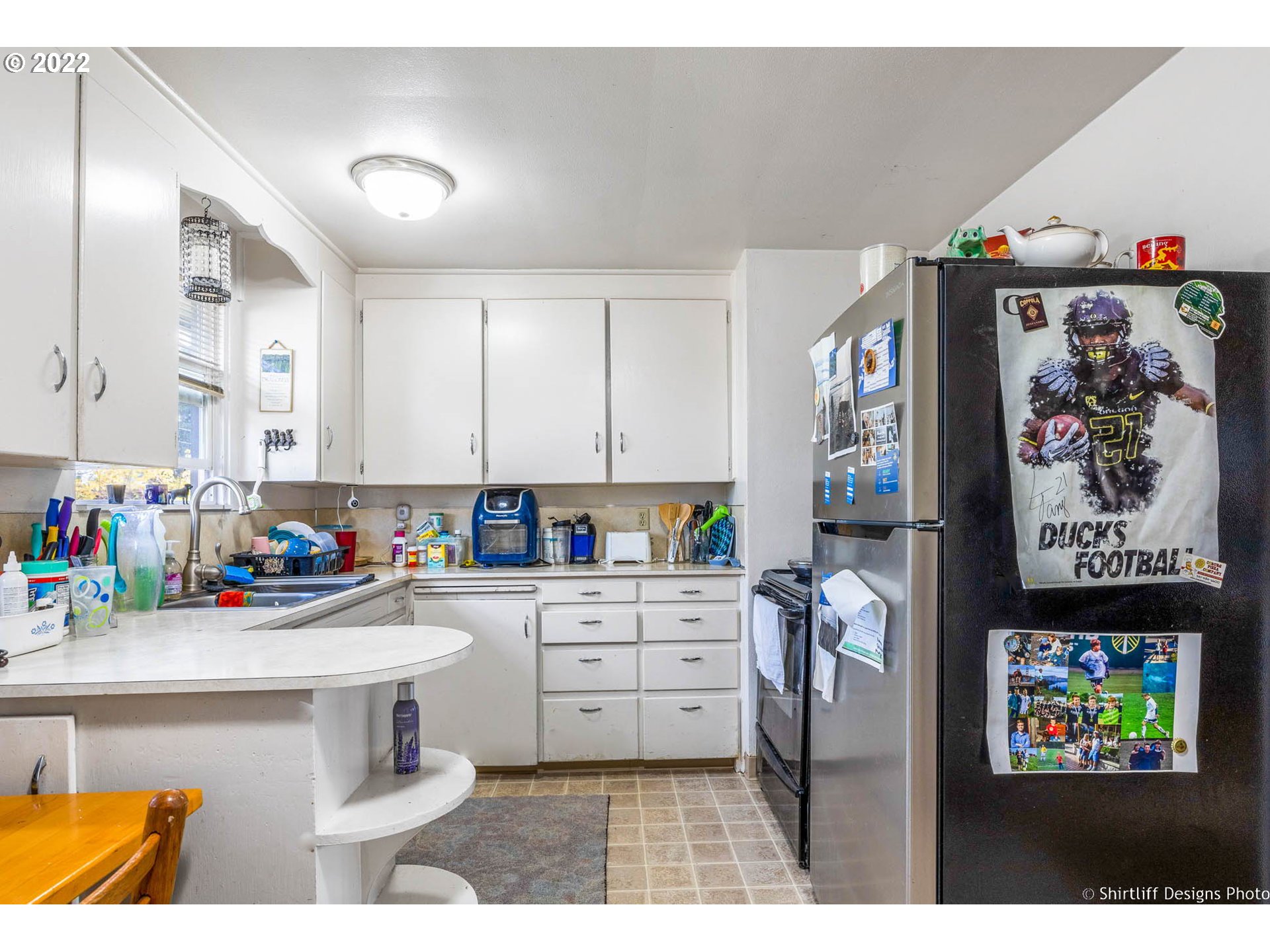 3878 South E Street Springfield, OR 97478 - Photo 11 of 24 a kitchen with a refrigerator and a sink