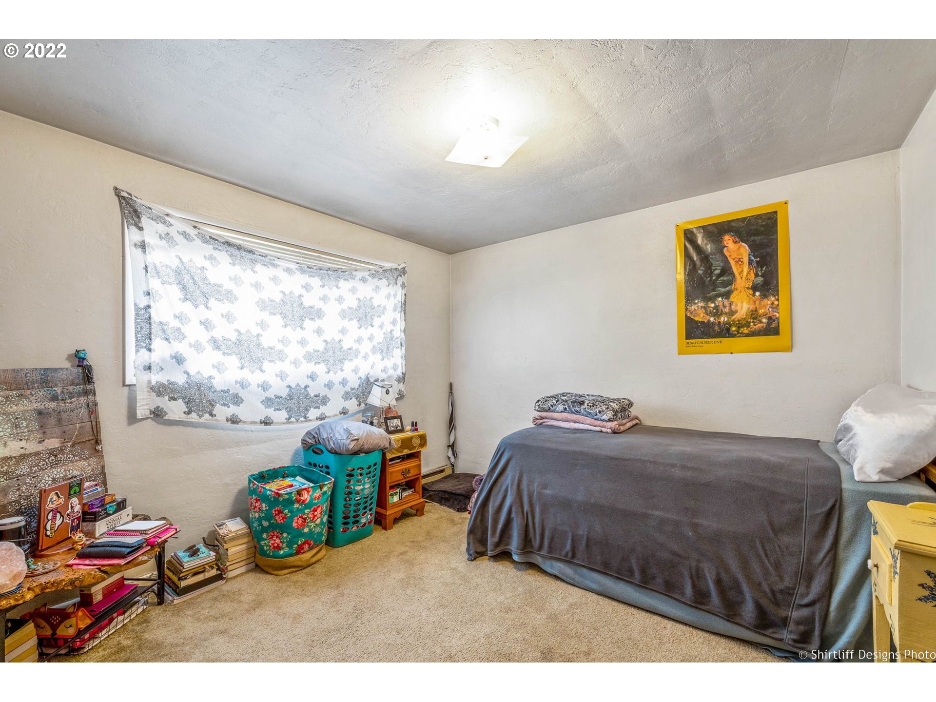 3878 South E Street Springfield, OR 97478 - Photo 15 of 24 a bedroom with a bed and a painting on the wall