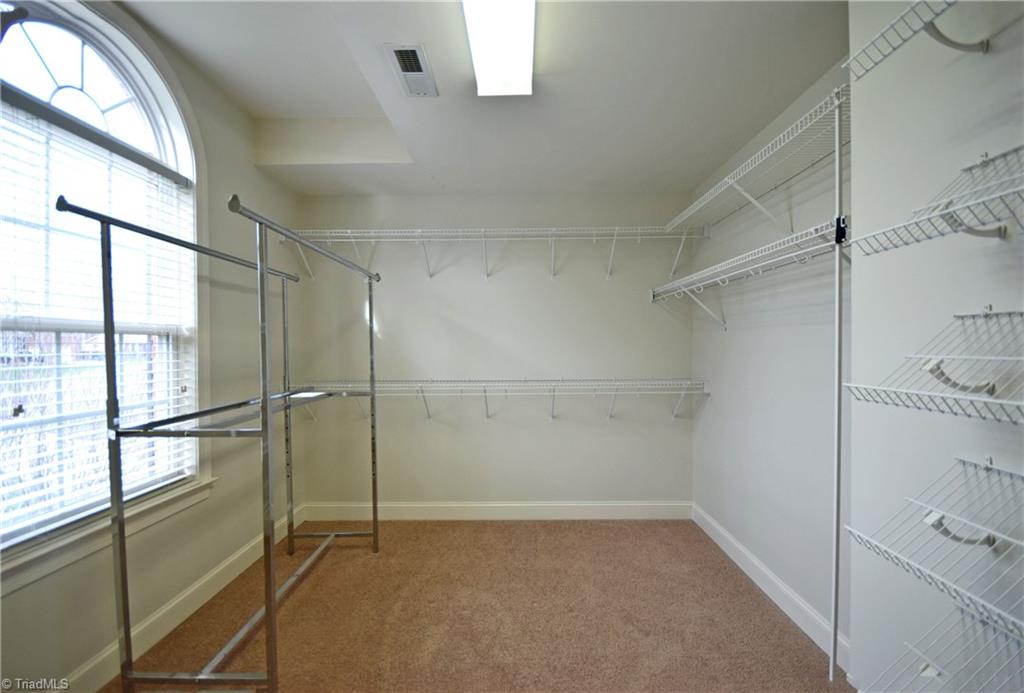 4021 Clinard Road Clemmons, NC 27012 - Photo 16 of 23 Master Closet with large window and organizers