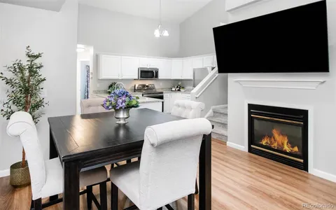 a living room with furniture fireplace and flat screen tv