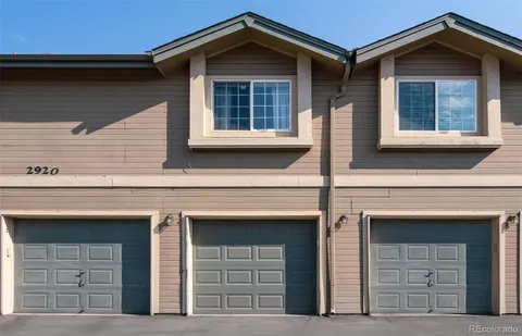 a front view of a house with garage