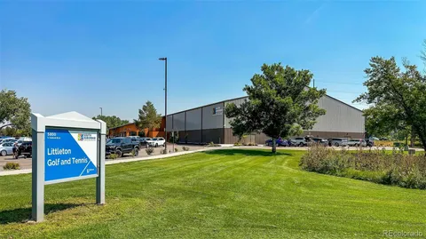 a house view with a sitting space and garden
