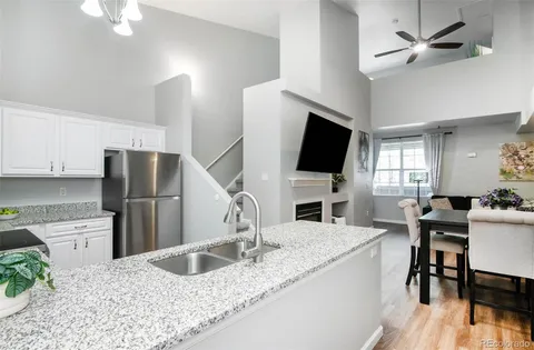 a kitchen with stainless steel appliances granite countertop a sink a microwave counter space and cabinets