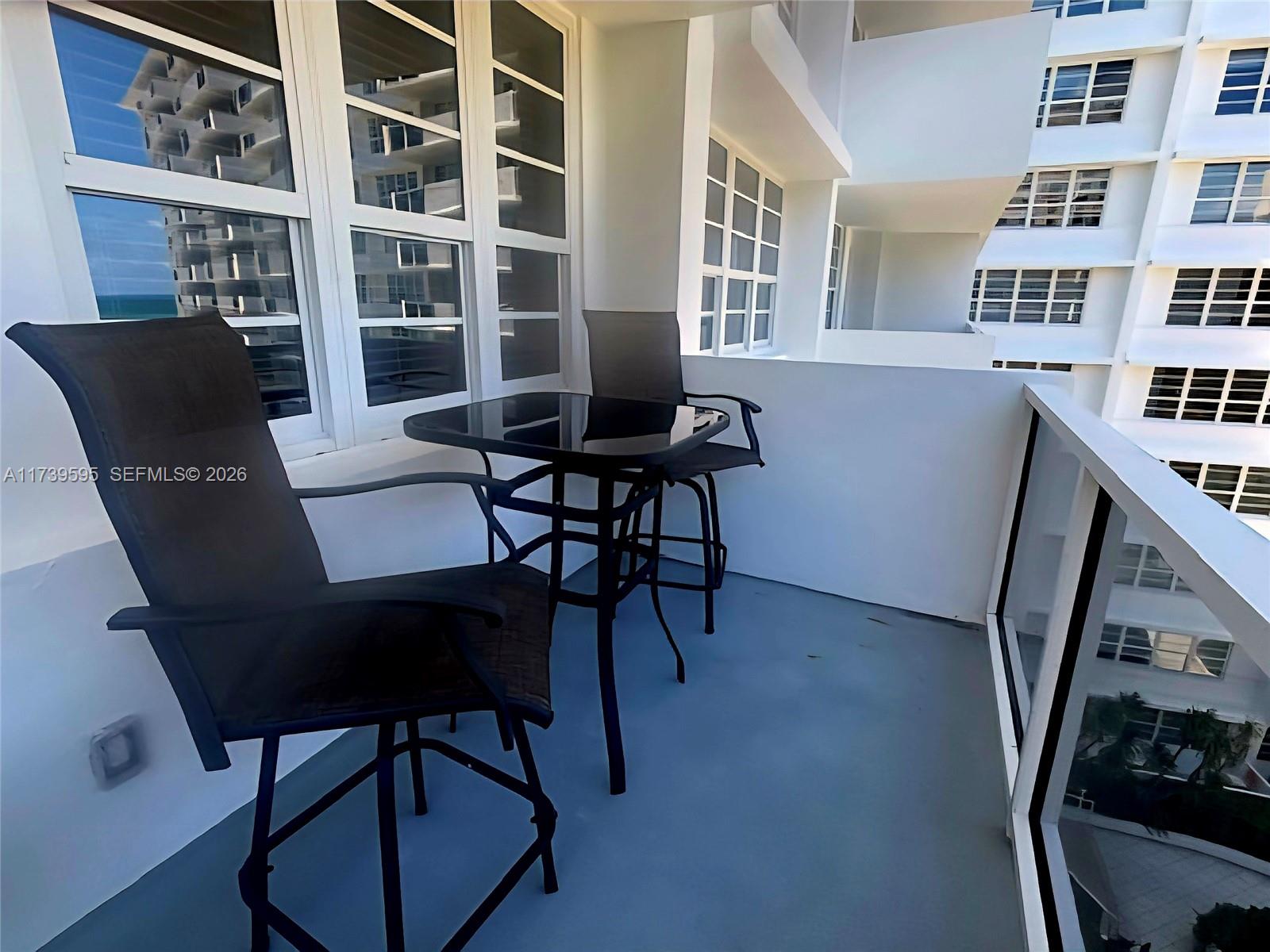 100 Lincoln Road, Unit 821 Miami Beach, FL 33139 - Photo 12 of 33 a workspace with furniture window and wooden floor