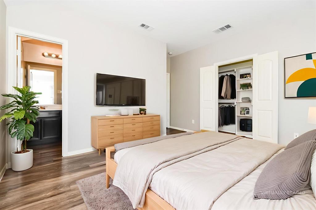 1821 Ridgecrest Drive Terrell, TX 75160 - Photo 11 of 18 a bedroom with a bed and a flat screen tv