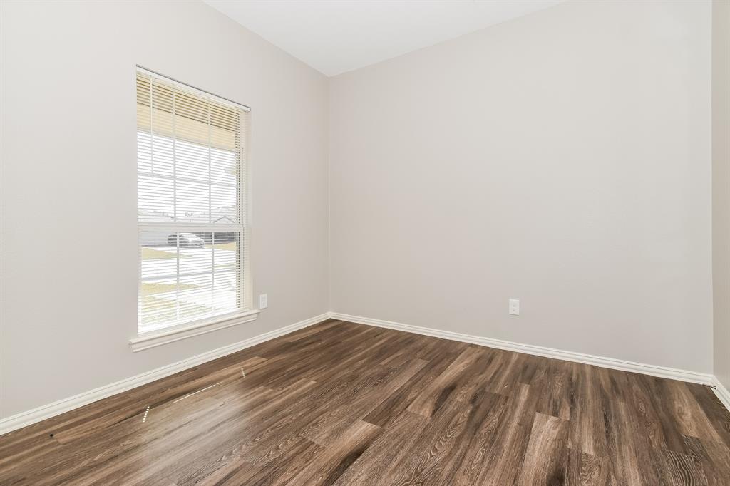 1821 Ridgecrest Drive Terrell, TX 75160 - Photo 12 of 18 an empty room with a window