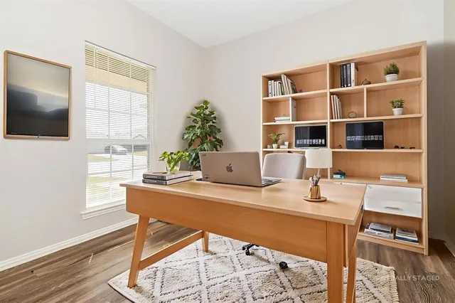 a workspace with furniture and window