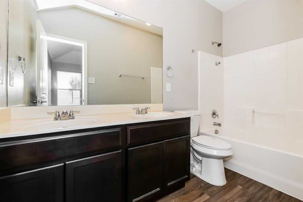 1821 Ridgecrest Drive Terrell, TX 75160 - Photo 15 of 18 a bathroom with a sink and a mirror