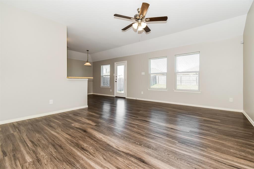 1821 Ridgecrest Drive Terrell, TX 75160 - Photo 2 of 18 wooden floor in an empty room with a window