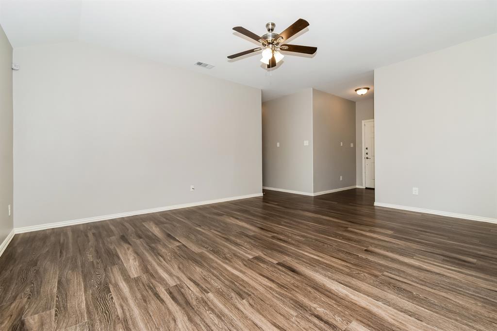 1821 Ridgecrest Drive Terrell, TX 75160 - Photo 4 of 18 a view of an empty room with wooden floor