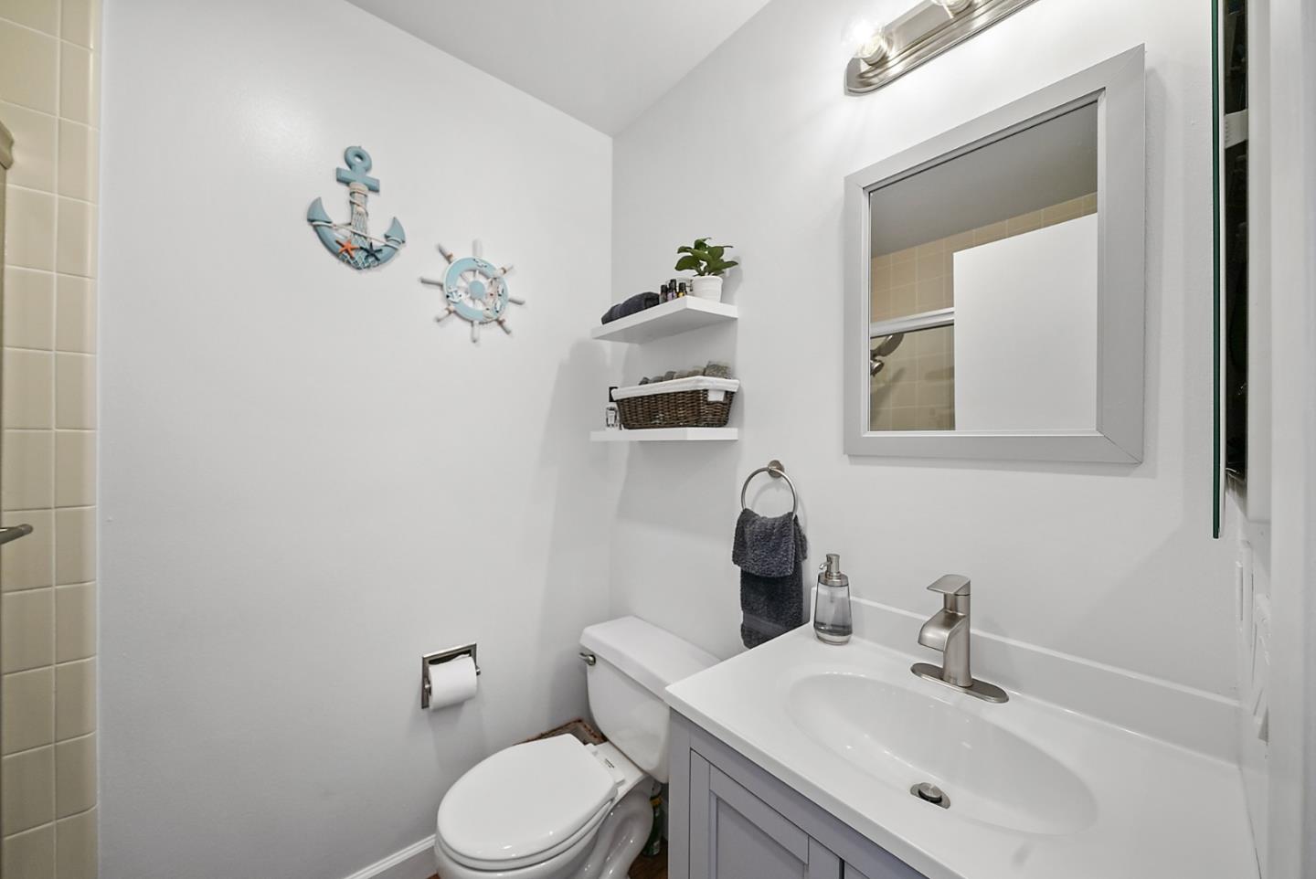 252 Bay Vista Circle Sausalito, CA 94965 - Photo 17 of 35 a bathroom with a sink a toilet and mirror