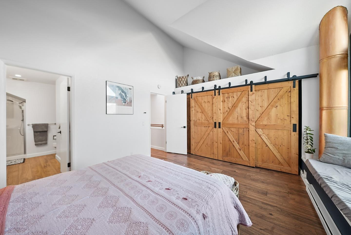 252 Bay Vista Circle Sausalito, CA 94965 - Photo 19 of 35 a bedroom with a large bed and a flat tv screen on dresser