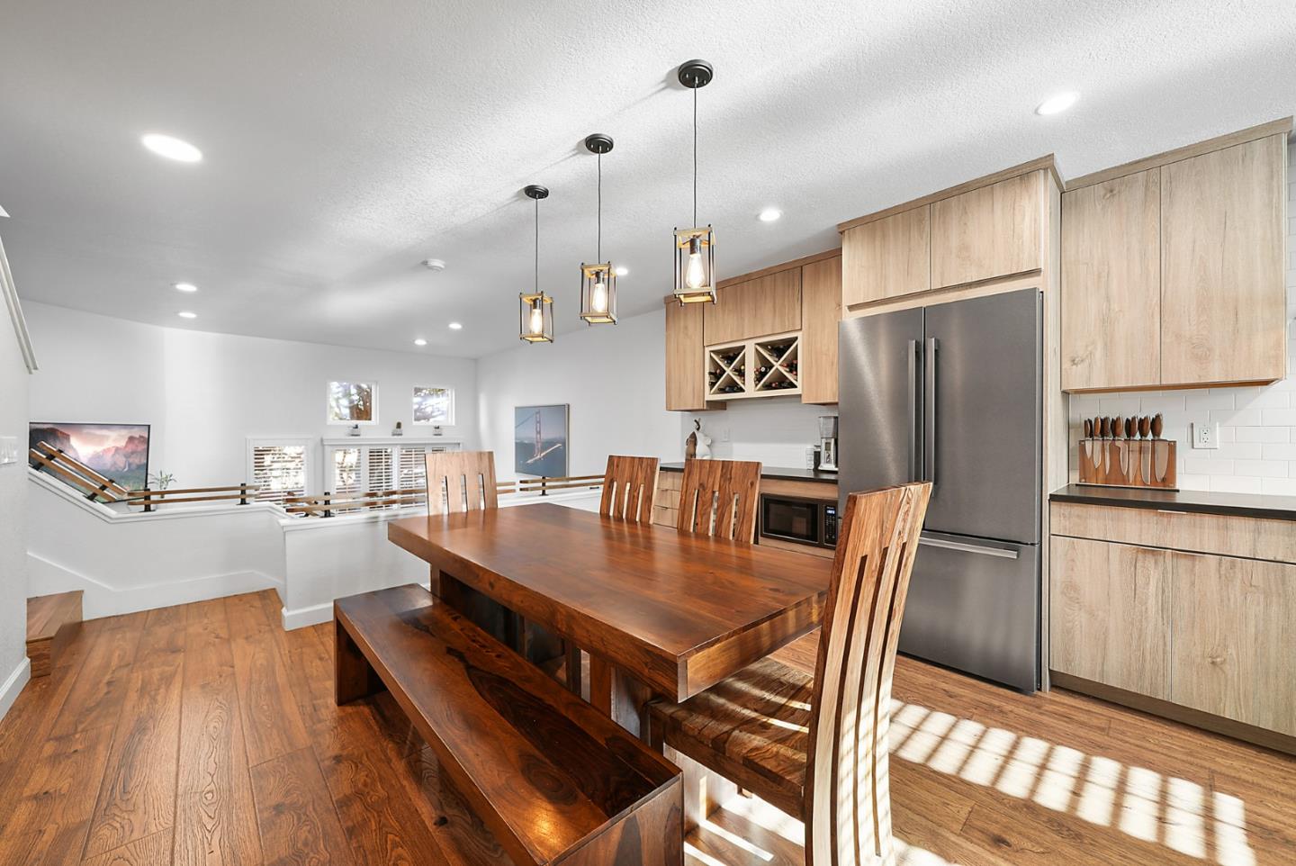 252 Bay Vista Circle Sausalito, CA 94965 - Photo 2 of 35 a kitchen with stainless steel appliances granite countertop a refrigerator a sink a stove a dining table and chairs
