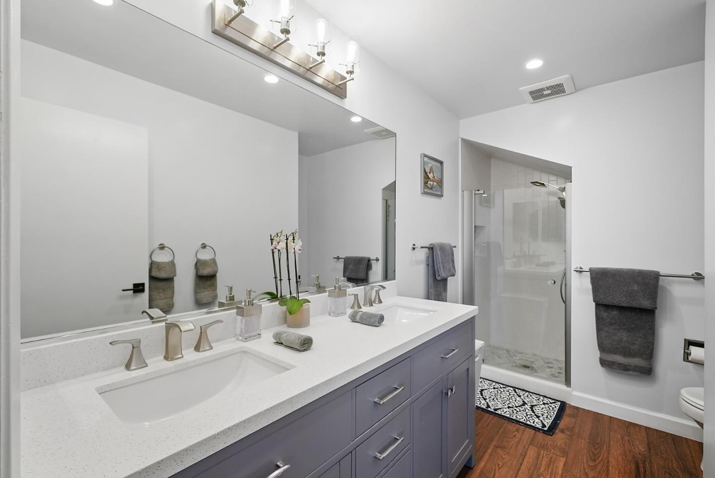 252 Bay Vista Circle Sausalito, CA 94965 - Photo 22 of 35 a bathroom with a double vanity sink and a mirror