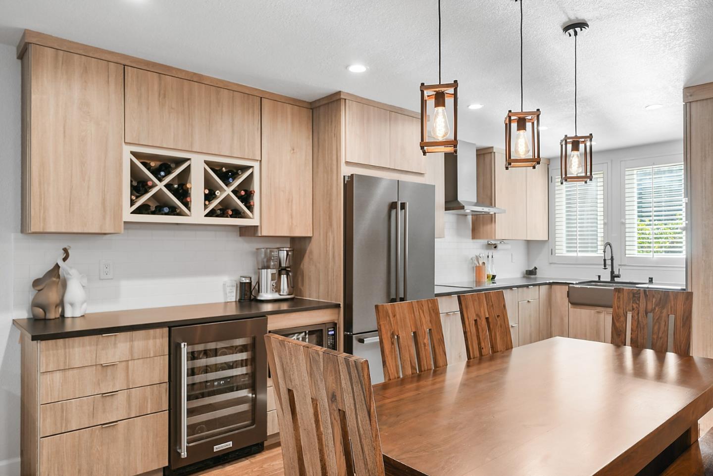 252 Bay Vista Circle Sausalito, CA 94965 - Photo 3 of 35 a kitchen with stainless steel appliances a dining table chairs and refrigerator