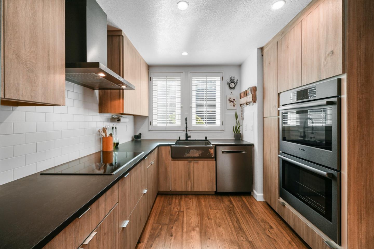 252 Bay Vista Circle Sausalito, CA 94965 - Photo 5 of 35 a kitchen with a sink stainless steel appliances and cabinets