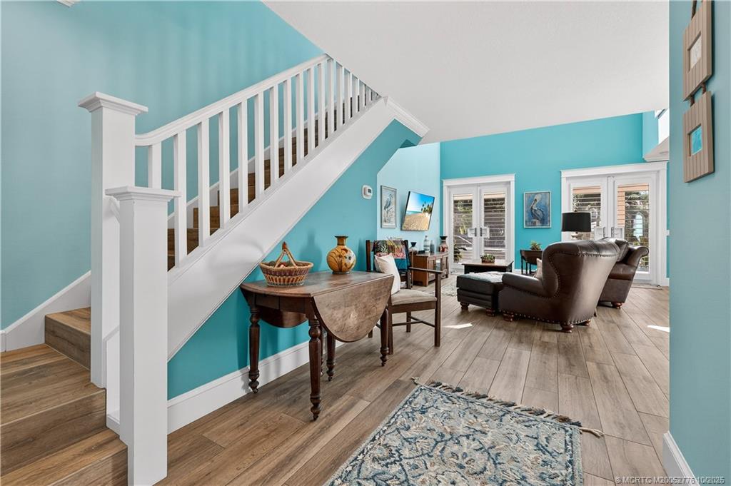 802 Southeast Portage Avenue Port St. Lucie, FL 34984 - Photo 12 of 48 a living room with furniture and a wooden floor