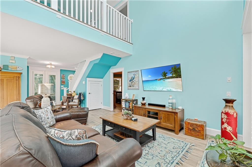 802 Southeast Portage Avenue Port St. Lucie, FL 34984 - Photo 16 of 48 a living room with furniture and a rug