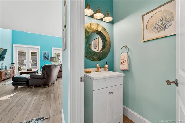 a bedroom with furniture and wooden floor