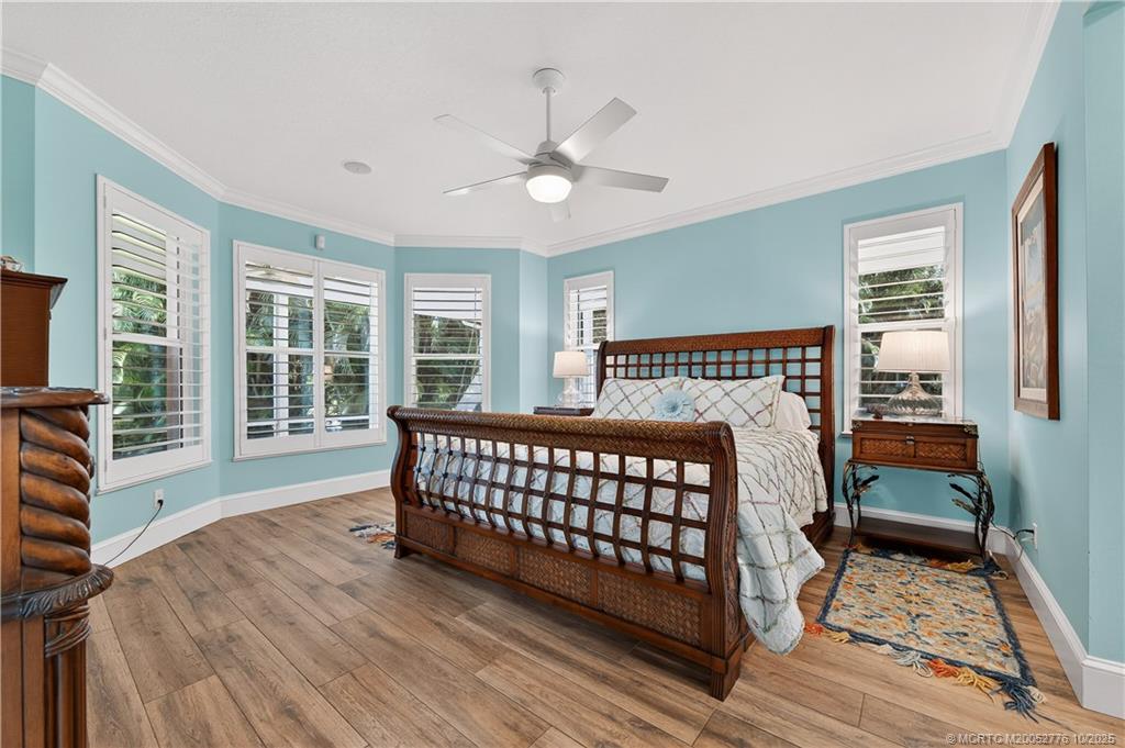 802 Southeast Portage Avenue Port St. Lucie, FL 34984 - Photo 24 of 48 a bedroom with furniture and wooden floor