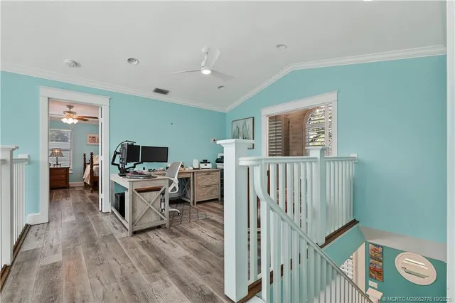a workspace with furniture and wooden floor
