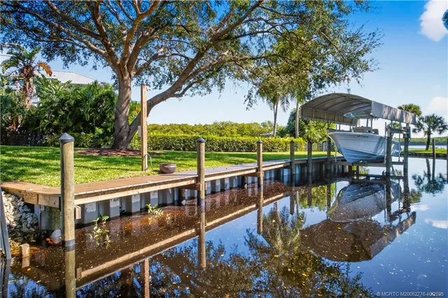 a view of a balcony with floor to ceiling windows with wooden floor