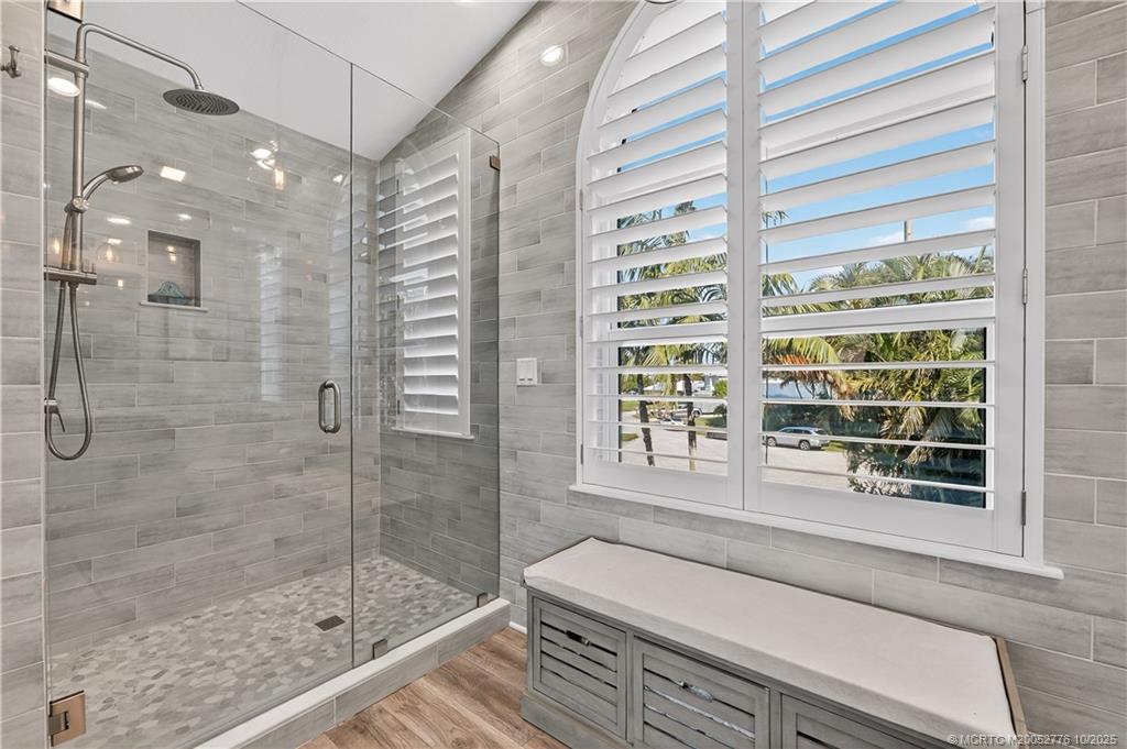 802 Southeast Portage Avenue Port St. Lucie, FL 34984 - Photo 32 of 48 a bathroom with a bathtub and a shower