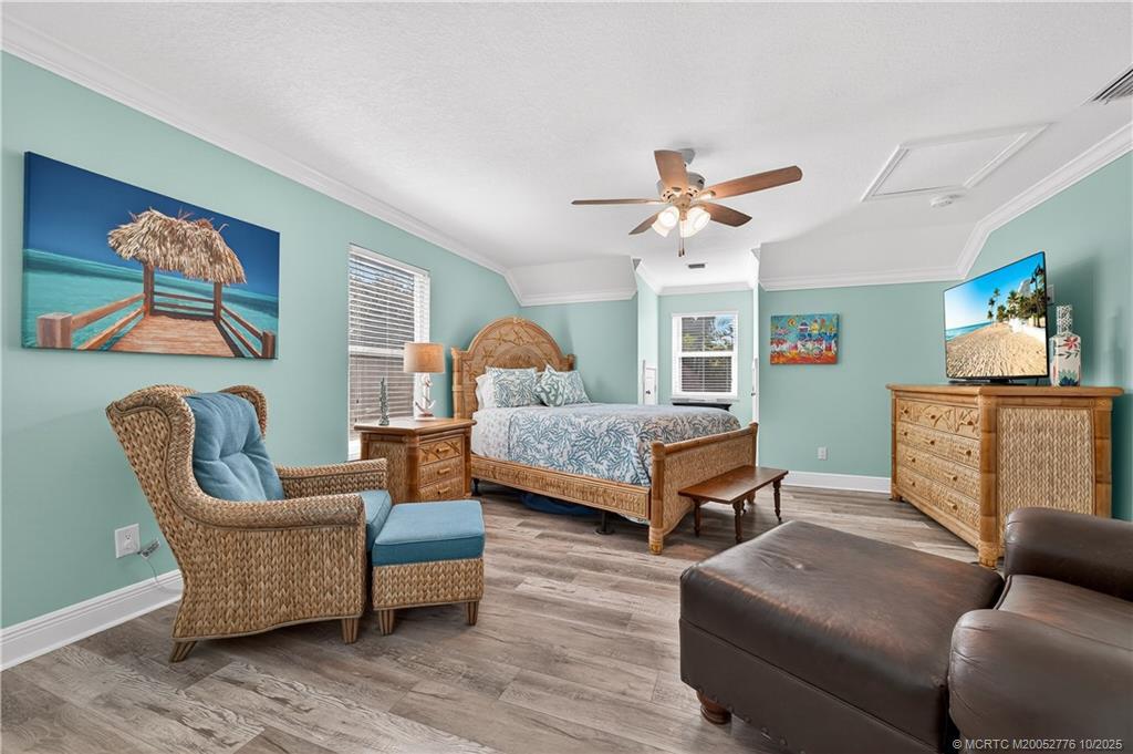 802 Southeast Portage Avenue Port St. Lucie, FL 34984 - Photo 34 of 48 a living room with furniture and a chandelier